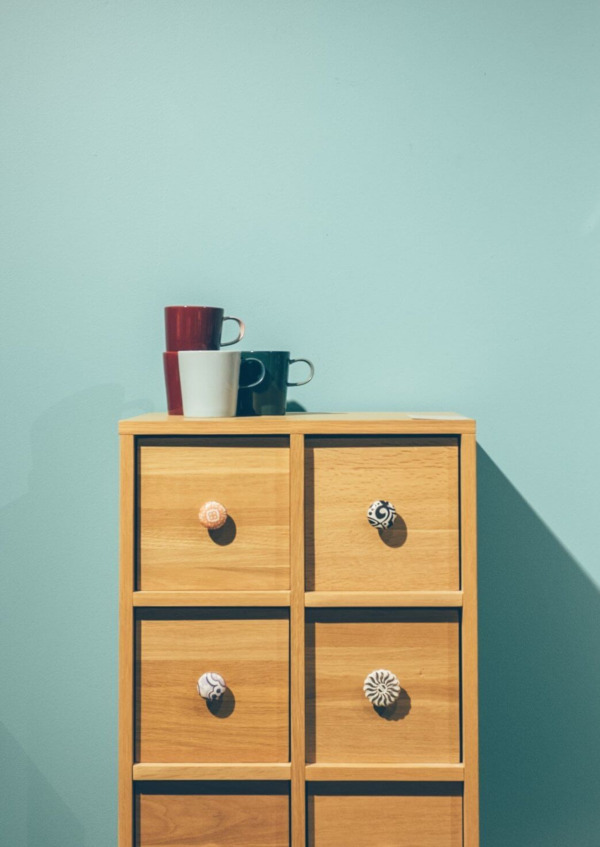 Cups and green wall